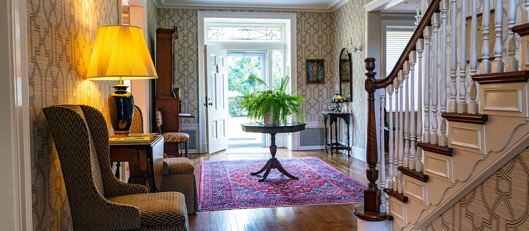 The front door to Walker House is open allowing sunshine to stream in to the well appointed foyer